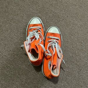 Orange high top converses. Size 5 women’s. Worn a few times.